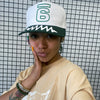 Jadesix white/green '6' snapback hat with wave brim design - sportswear that blends activism and self-expression