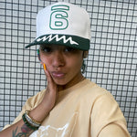 Jadesix white/green '6' snapback hat with wave brim design - sportswear that blends activism and self-expression