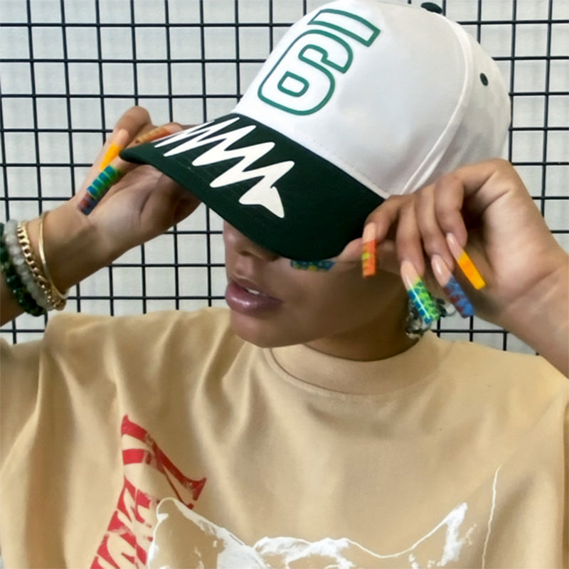 Jadesix white/green '6' snapback hat with wave brim design - sportswear that blends activism and self-expression