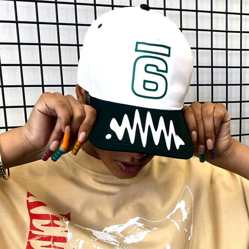 Jadesix white/green '6' snapback hat with wave brim design - sportswear that blends activism and self-expression